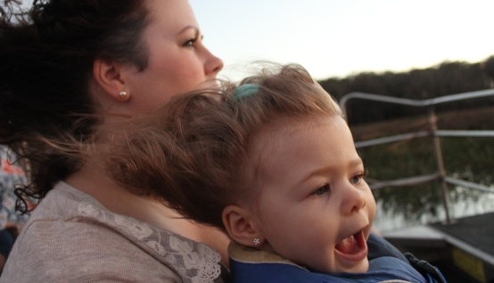 Young child and her mother enjoying a Wild Florida airboat tour.