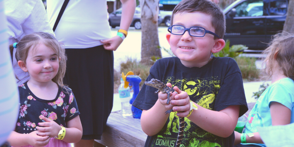 Child enjoying free Gator Park admission during Gator Week